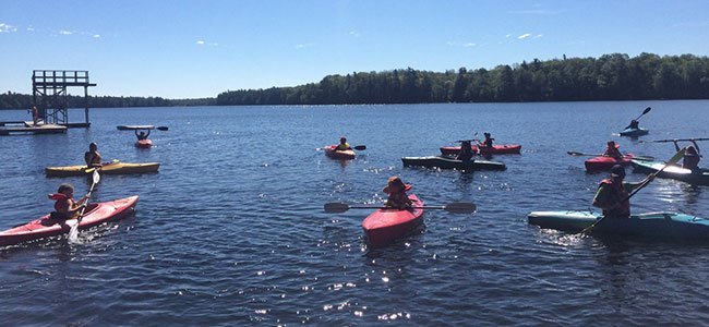 students in kayaks at gould lake outdoor ed ctr